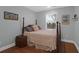 Cozy bedroom features hardwood floors, a bed and a window for natural light at 17 24Th Ave, Isle of Palms, SC 29451