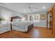 Bright bedroom features hardwood floors, a queen-size bed and a ceiling fan at 17 24Th Ave, Isle of Palms, SC 29451