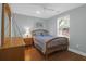 Bright bedroom with hardwood floors, bed and dresser with light-blue colored walls at 17 24Th Ave, Isle of Palms, SC 29451