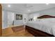 Cozy bedroom boasts light blue walls, a dark wood bedframe and an ensuite bathroom at 17 24Th Ave, Isle of Palms, SC 29451