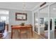 Cozy dining nook featuring tile floors and a sliding glass door, offering natural light and easy outdoor access at 17 24Th Ave, Isle of Palms, SC 29451