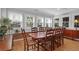 Bright dining area features hardwood floors, large windows, and classic furnishings for stylish entertaining at 17 24Th Ave, Isle of Palms, SC 29451