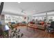Expansive living area with hardwood floors, bright windows, and cozy seating, ideal for gatherings and relaxation at 17 24Th Ave, Isle of Palms, SC 29451