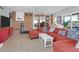 Relaxing living room features tile flooring, large couch, and access to the yard at 17 24Th Ave, Isle of Palms, SC 29451