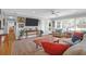 Bright, airy living room featuring hardwood floors, recessed lights, and large windows offering an open design at 17 24Th Ave, Isle of Palms, SC 29451
