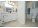 Bright bathroom featuring a full vanity, mirror, and separate toilet and shower areas at 1722 S Nicole Pl, Charleston, SC 29414