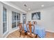 Bright dining area with large windows, elegant table setting, and cozy ambiance for enjoyable meals at 1722 S Nicole Pl, Charleston, SC 29414