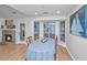 Charming dining area with natural light, seamlessly connected to the living room with fireplace, perfect for gatherings at 1722 S Nicole Pl, Charleston, SC 29414