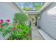 Charming front entrance with blooming flowers, inviting pathway, and a glimpse of the welcoming interior at 1722 S Nicole Pl, Charleston, SC 29414