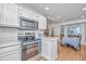 Updated kitchen boasting stainless steel appliances, white cabinetry, and breakfast nook at 1722 S Nicole Pl, Charleston, SC 29414