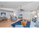 Open living room features hardwood floors, a ceiling fan, and seamless transition to the dining area for entertaining at 1722 S Nicole Pl, Charleston, SC 29414