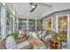 Cozy sunroom featuring wicker furniture, a ceiling fan, and lots of natural light at 1722 S Nicole Pl, Charleston, SC 29414