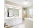 Bright bathroom with double vanity, large mirror, and a separate shower at 192 Bamert St, Summerville, SC 29483