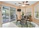Cozy breakfast nook featuring a table with seating for four, views of the patio, and a ceiling fan at 192 Bamert St, Summerville, SC 29483