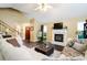 Comfortable living room featuring a fireplace, hardwood floors, ample seating, and natural light at 192 Bamert St, Summerville, SC 29483