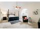 Spacious main bedroom featuring a four-poster bed, ceiling fan, and sitting area at 192 Bamert St, Summerville, SC 29483