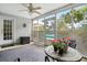 Relaxing screened porch with outdoor seating, a ceiling fan, views of the backyard, and access to the pool at 192 Bamert St, Summerville, SC 29483