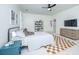 Bright bedroom with ceiling fan, television, and stylish decor at 2013 Grey Marsh Rd, Mount Pleasant, SC 29466