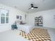 Comfortable bedroom with natural light, ceiling fan, and unique checker rug at 2013 Grey Marsh Rd, Mount Pleasant, SC 29466