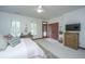 This bedroom is staged with a desk, and light neutral tones at 2013 Grey Marsh Rd, Mount Pleasant, SC 29466