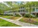 Attractive multi-story home with covered porches, healthy green lawn, and sidewalk at 2013 Grey Marsh Rd, Mount Pleasant, SC 29466