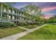 Beautiful multi-story home with covered porches, lush landscaping, and a sidewalk at 2013 Grey Marsh Rd, Mount Pleasant, SC 29466