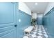 Hallway with wainscoting, coat hooks, checkerboard floor and bench at 2013 Grey Marsh Rd, Mount Pleasant, SC 29466