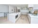 Modern kitchen with a large island, marble countertops, and stainless steel appliances at 2013 Grey Marsh Rd, Mount Pleasant, SC 29466
