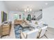 Bright living room featuring hardwood floors, modern furniture, and staircase at 2013 Grey Marsh Rd, Mount Pleasant, SC 29466