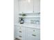 Well-organized pantry with white cabinets, marble countertops, and stylish storage solutions at 2013 Grey Marsh Rd, Mount Pleasant, SC 29466