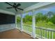This porch has white columns, a ceiling fan, and beautiful outdoor views at 2013 Grey Marsh Rd, Mount Pleasant, SC 29466