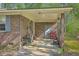 Attached carport with ample space for parking and storage, featuring brick columns and utility access at 202 Oak Cir, Walterboro, SC 29488