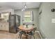 The dining area features a wooden table and dark seating, complemented by a pendant light fixture at 202 Oak Cir, Walterboro, SC 29488