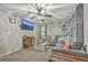 Spacious living room featuring a large gray sectional, ceiling fan, and wall-mounted TV for entertainment at 202 Oak Cir, Walterboro, SC 29488
