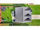 Aerial view of a well-maintained property with a lush green lawn, patio, and trampoline at 204 Honey Horn Dr, Summerville, SC 29486