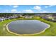 Aerial view of the community featuring a pond, swimming pool, and well-maintained landscaping at 204 Honey Horn Dr, Summerville, SC 29486