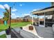 Spacious backyard view of patio, screened-in porch, trampoline and playground set, perfect for outdoor living at 204 Honey Horn Dr, Summerville, SC 29486