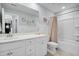 Bathroom with white cabinetry, framed mirror, and a shower-tub combo at 204 Honey Horn Dr, Summerville, SC 29486