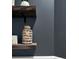 Modern bathroom decor featuring rustic shelving, unique accents, and custom textured container at 204 Honey Horn Dr, Summerville, SC 29486