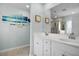 Bright bathroom with double sinks, white cabinets, and a large mirror at 204 Honey Horn Dr, Summerville, SC 29486