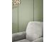 Close up of glider chair and decorative green accent wall at 204 Honey Horn Dr, Summerville, SC 29486