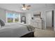 Bright primary bedroom with a view, dresser, and stylish decor at 204 Honey Horn Dr, Summerville, SC 29486