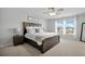 Primary bedroom features a rustic wood bed frame with plush linens and great natural light at 204 Honey Horn Dr, Summerville, SC 29486