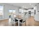 Dining area featuring an adjacent kitchen area with white cabinets and stainless steel appliances at 204 Honey Horn Dr, Summerville, SC 29486