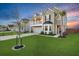 Beautiful two-story home showcases a lovely front balcony, lush lawn, mature palm tree, and a spacious driveway at 204 Honey Horn Dr, Summerville, SC 29486