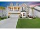 Charming two-story home boasting a front-facing balcony, well-manicured lawn, and a spacious two-car garage at 204 Honey Horn Dr, Summerville, SC 29486