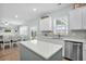 An open concept kitchen featuring an island and dining area with sliding doors to the back yard at 204 Honey Horn Dr, Summerville, SC 29486