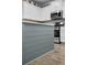 Kitchen island features modern appliances, a grey backsplash, and bright lighting at 204 Honey Horn Dr, Summerville, SC 29486