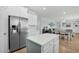 An open kitchen and dining area featuring stainless steel appliances and a view into the living area at 204 Honey Horn Dr, Summerville, SC 29486