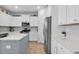 Kitchen featuring white cabinets, stainless steel appliances, hard surface countertops, and wood flooring at 204 Honey Horn Dr, Summerville, SC 29486
